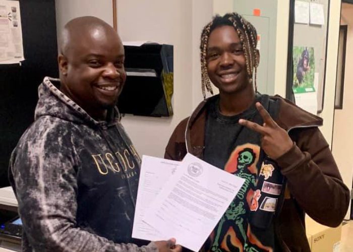 Robert Buchanan welcoming his son Robert Buchanan Jr. as a new Local 54 member in 2022.